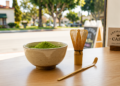 Bright green matcha latte with foam, an example of high-quality ceremonial-grade matcha preparation