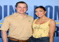 Jett Puckett and his wife Campbell posing together at an outdoor event.