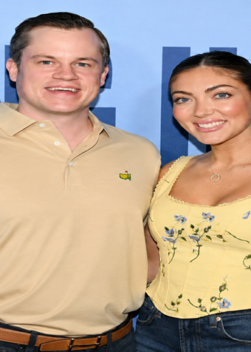Jett Puckett and his wife Campbell posing together at an outdoor event.
