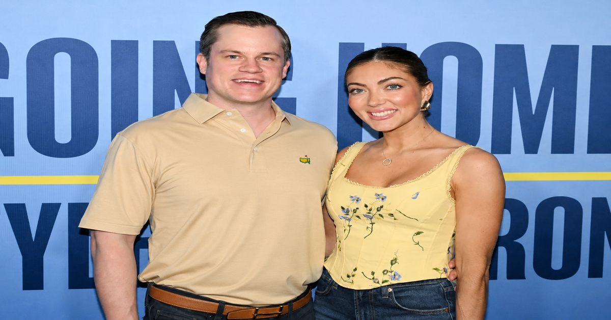 Jett Puckett and his wife Campbell posing together at an outdoor event.